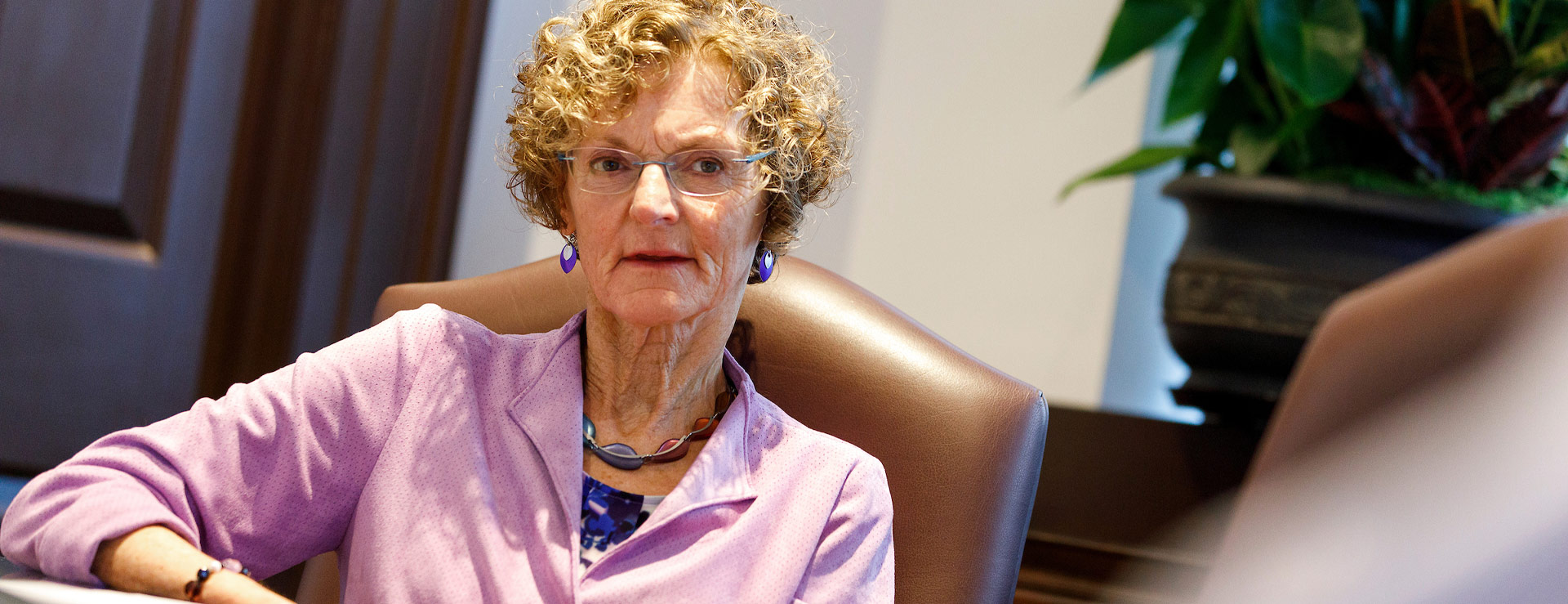 Ruth Mullen seated in conference room